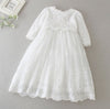 Carriage Boutique white long sleeve christening gown featuring intricate lace embroidery and a scalloped hem