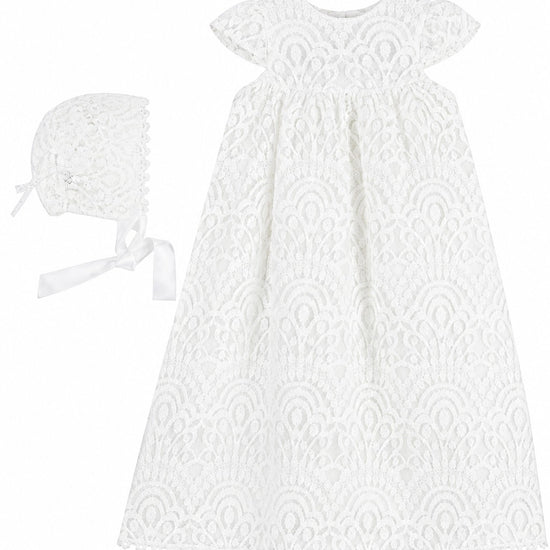Carriage Boutique white lace christening gown with matching bonnet for baby girls, featuring intricate floral patterns.