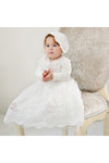 Carriage Boutique white lace christening gown with long sleeves, scalloped hem, and matching bonnet on a baby girl.