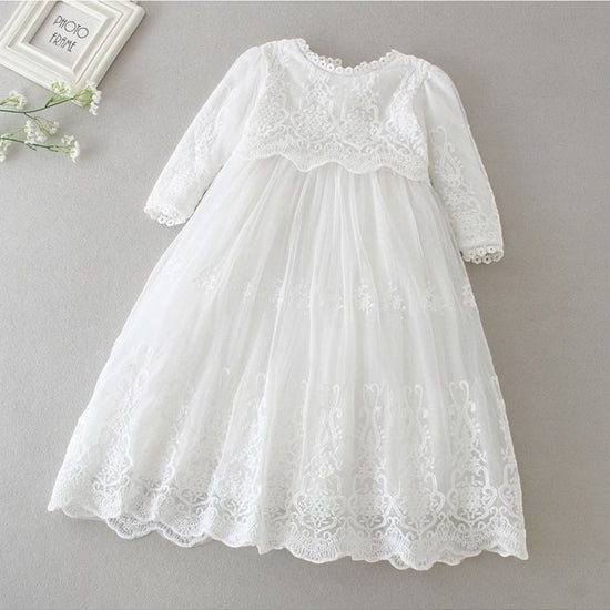 Carriage Boutique white long sleeve lace christening gown with intricate embroidery and scalloped hem detail