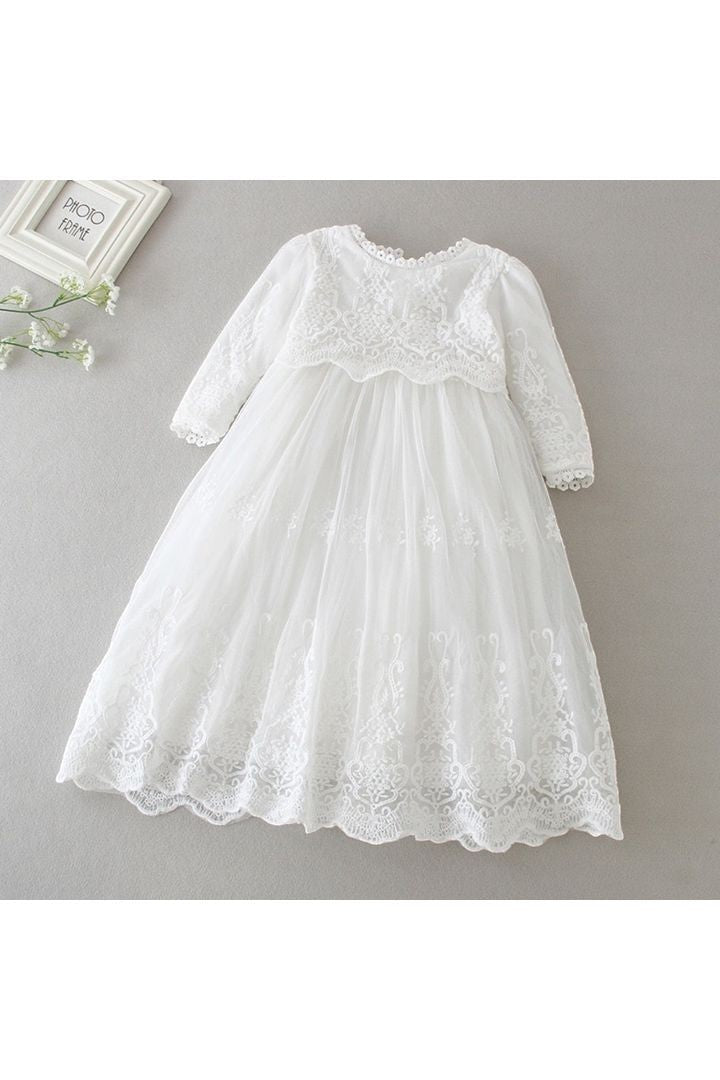Carriage Boutique white long sleeve lace christening gown with intricate embroidery and scalloped hem detail