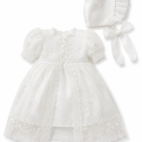 Carriage Boutique white lace christening gown with puffed sleeves and matching bonnet for baby girls