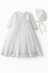 Carriage Boutique white long sleeve lace christening gown with intricate embroidery, scalloped hem, and matching bonnet.