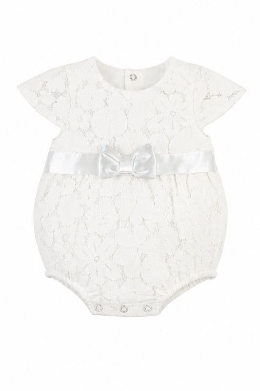 Carriage Boutique white lace baby girl christening bubble romper with a satin waist ribbon and bow detail.