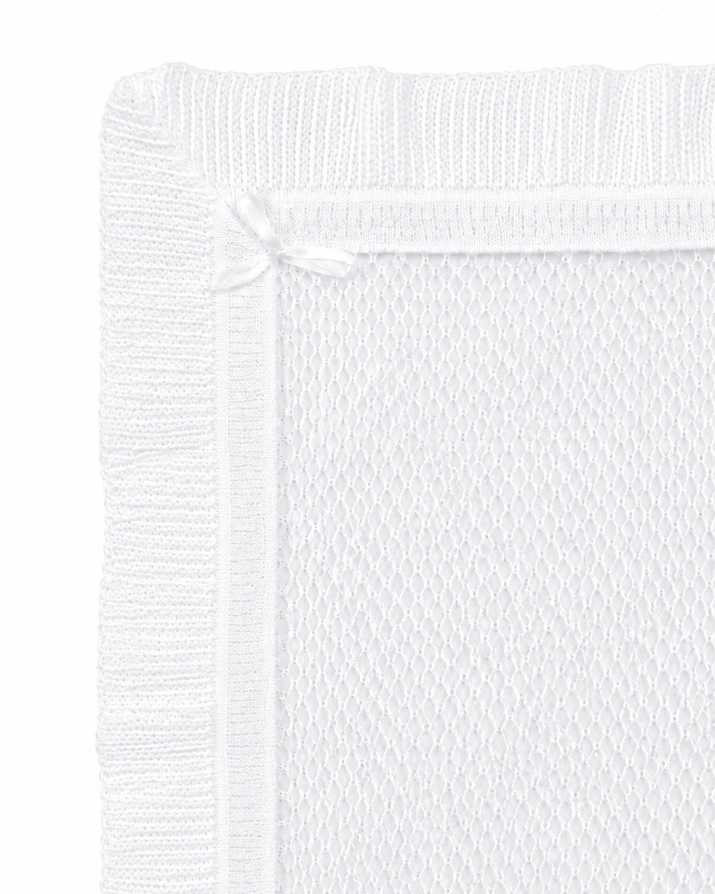 Carriage Boutique white christening blanket with delicate Belgium lace, ribbed border, and a small satin ribbon bow.