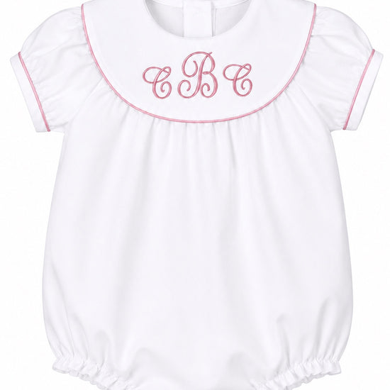 Carriage Boutique white cotton baby girl bubble with pink monogram embroidery, flutter sleeves, and picot trim.