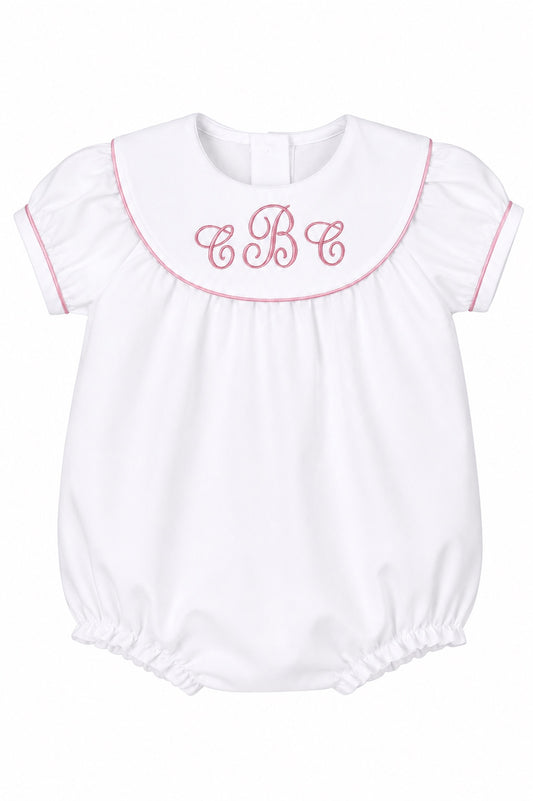 Carriage Boutique white cotton baby girl bubble with pink monogram embroidery, flutter sleeves, and picot trim.