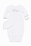 Carriage Boutique white newborn sleep sack with matching hat featuring elegant scalloped trim and custom embroidery