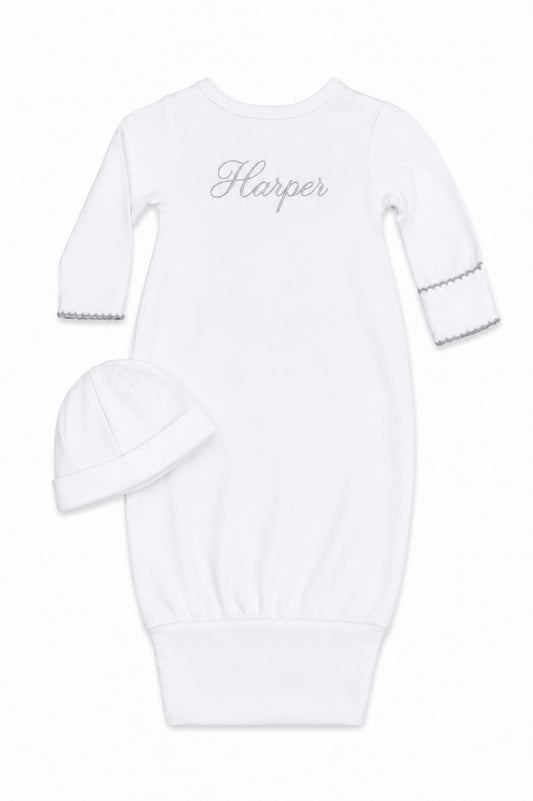 Carriage Boutique white newborn sleep sack with matching hat featuring elegant scalloped trim and custom embroidery
