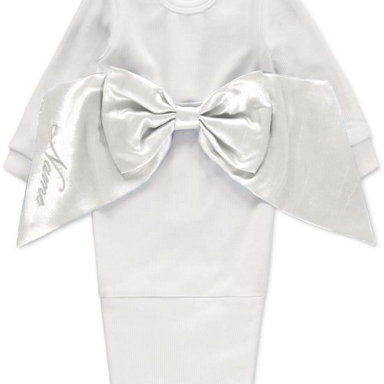 Carriage Boutique white newborn baby swaddle gown featuring a large satin bow and fold-over bottom for easy dressing.