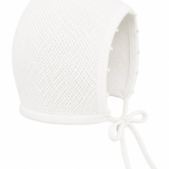 Carriage Boutique white baby girl christening bonnet with delicate pebble stitch texture and ribbon tie closure