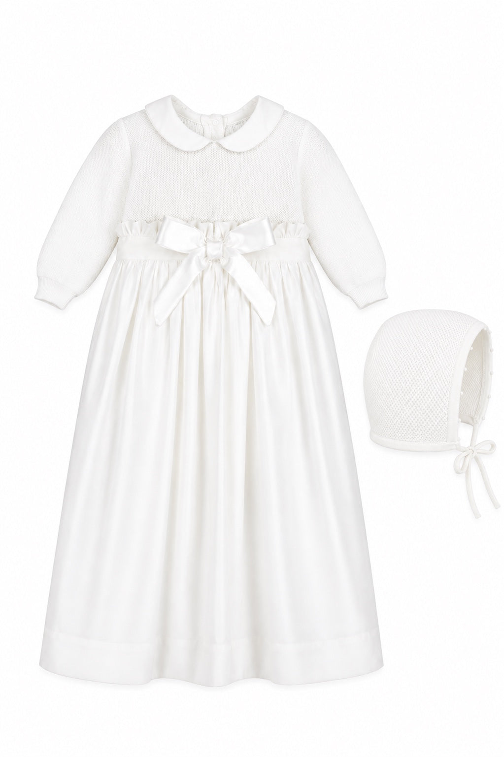 Carriage Boutique white baby girl christening gown with pebble stitch bodice, satin bow, and matching bonnet.