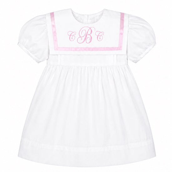 Carriage Boutique white and pink short sleeve baby dress with a sailor collar and embroidered monogram detail