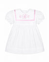 Carriage Boutique white and pink short sleeve baby dress with a sailor collar and embroidered monogram detail