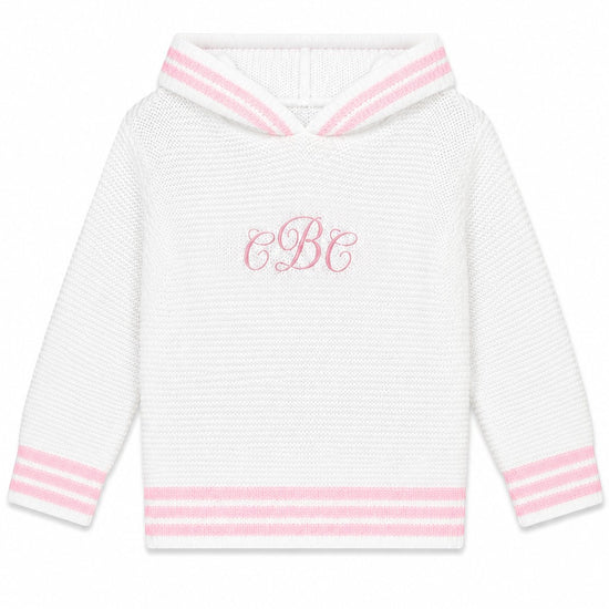 Carriage Boutique personalized white knit baby sweater with pink striped trim, hood, and monogrammed chest detail.