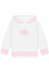 Carriage Boutique personalized white knit baby sweater with pink striped trim, hood, and monogrammed chest detail.