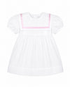 Carriage Boutique white and pink baby dress with short puff sleeves and a sailor-style collar in soft cotton