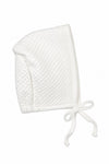 Carriage Boutique white quilted baby bonnet with delicate lace trim and ribbon tie for a bris ceremony.