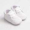 Carriage Boutique white quilted baby boy christening shoes with soft soles and satin ribbon laces for baptism.