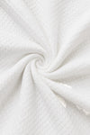 Carriage Boutique white quilted fabric texture for a baby bris outfit with a soft diamond pattern