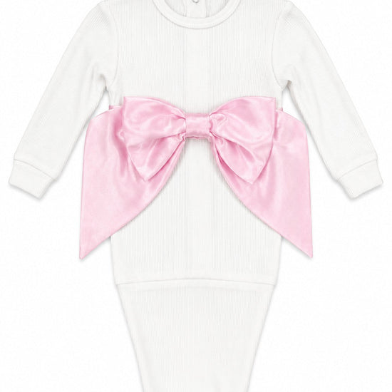 Carriage Boutique newborn baby girl white ribbed cotton swaddle bag featuring a large satin pink bow detail