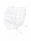 Carriage Boutique white baby bonnet with delicate pink rosebud print, lace trim, and soft fabric tie closure.