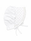 Carriage Boutique white baby bonnet featuring a delicate pink rosebud print, lace trim, and soft fabric ties.