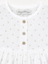 Carriage Boutique white baby dress with delicate rosebud floral print and three rustic wooden buttons on the bodice.