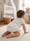 Carriage Boutique baby girl cotton diaper cover in white with floral ruffles and personalized pink embroidery