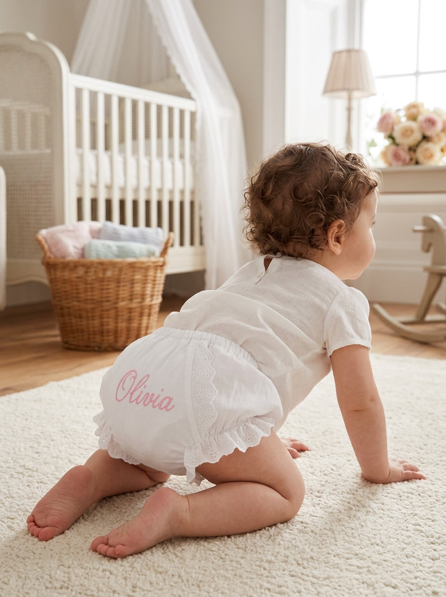 Carriage Boutique baby girl cotton diaper cover in white with floral ruffles and personalized pink embroidery