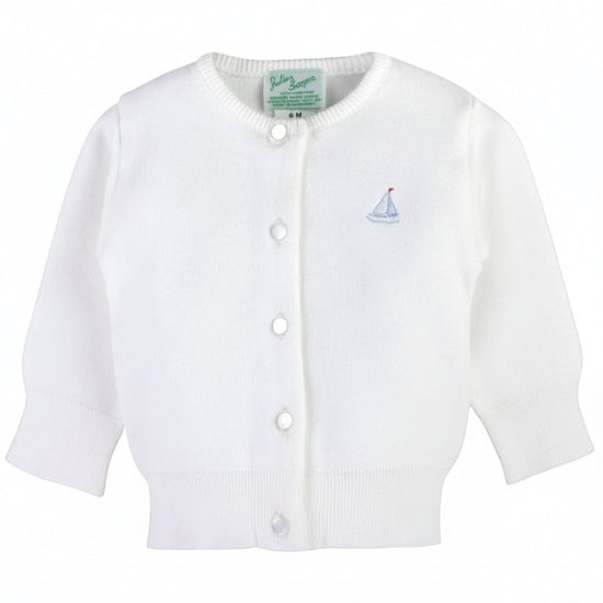 Carriage Boutique white cotton baby cardigan featuring a small embroidered sailboat motif and front button closure.