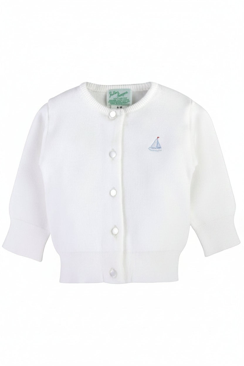Carriage Boutique white cotton baby cardigan featuring a small embroidered sailboat motif and front button closure.