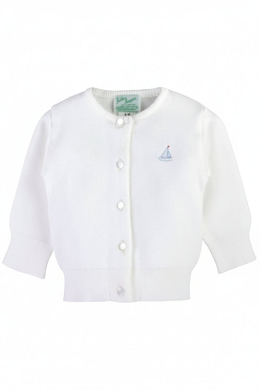 Carriage Boutique white cotton baby cardigan featuring a small embroidered sailboat motif and front button closure.