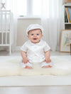Carriage Boutique white satin vested baby boy romper with hat for christening or baptism. Short sleeves, button front.