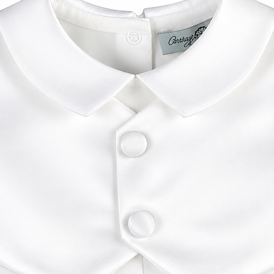 Carriage Boutique white satin christening romper featuring a Peter Pan collar and elegant fabric-covered buttons.