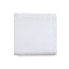 Carriage Boutique white cotton baby blanket with a delicate textured knit, diamond pattern, and scalloped edge.