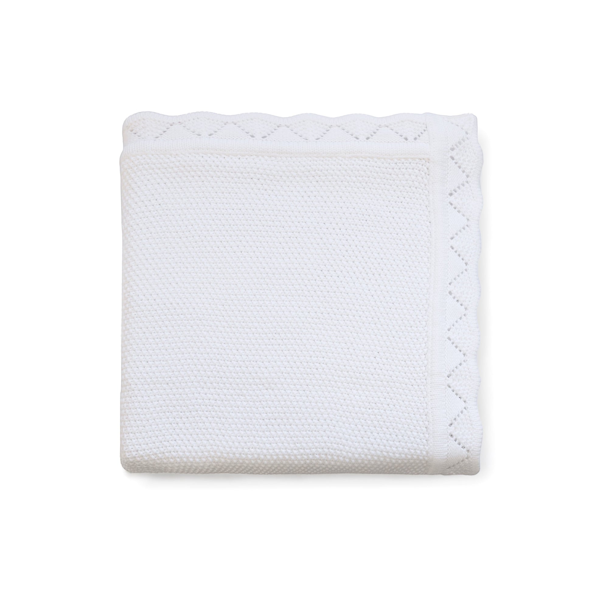 Carriage Boutique white cotton baby blanket with a delicate textured knit, diamond pattern, and scalloped edge.