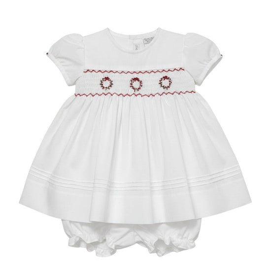 Carriage Boutique white short sleeve baby dress with red hand smocking and delicate wreath embroidery details