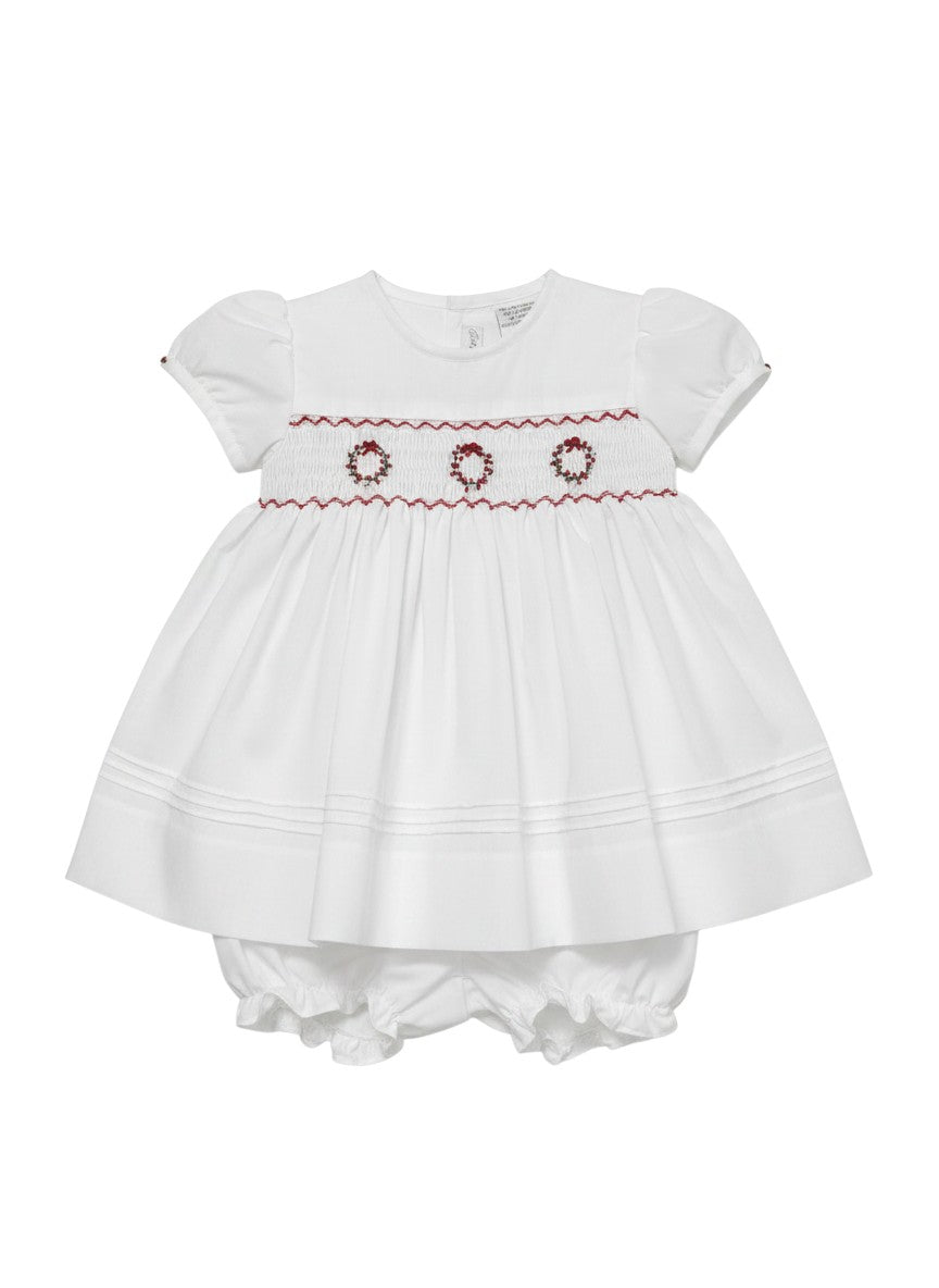 Carriage Boutique white short sleeve baby dress with red hand smocking and delicate wreath embroidery details