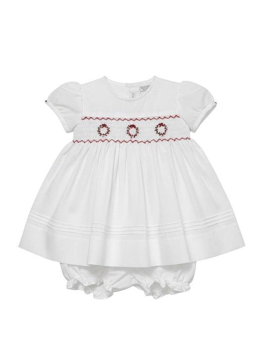 Carriage Boutique white short sleeve baby dress with red hand smocking and delicate wreath embroidery details