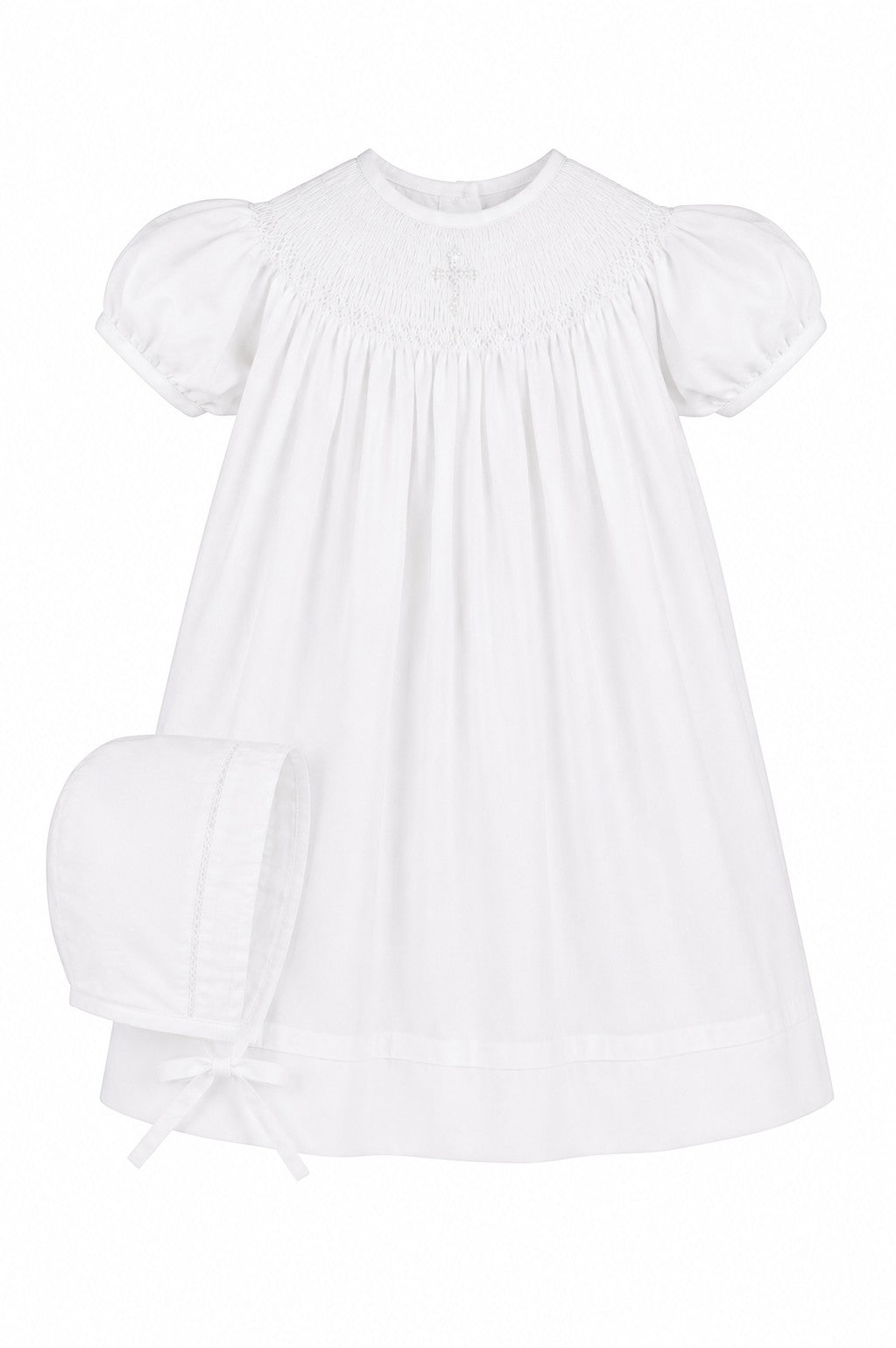 Carriage Boutique white cotton baby bishop dress with hand smocked pearl cross detail and matching bonnet