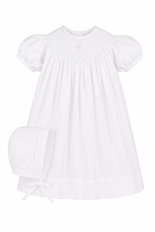 Carriage Boutique white cotton baby bishop dress with hand smocked pearl cross detail and matching bonnet