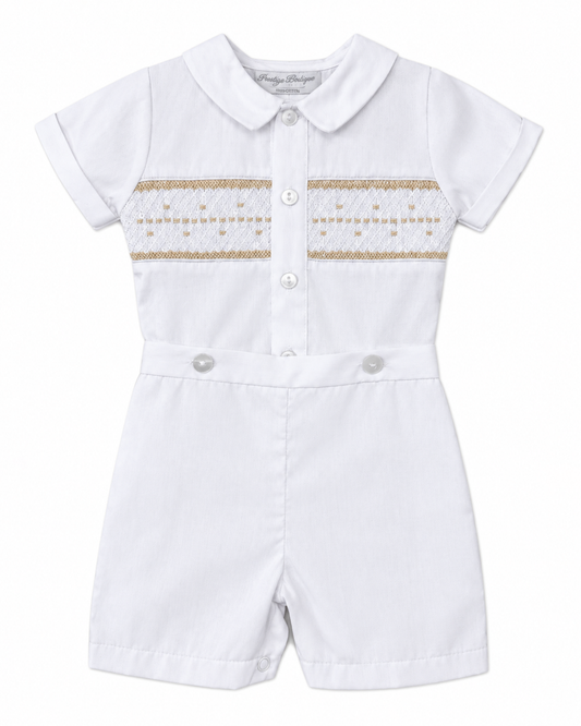 Carriage Boutique white baby boy bobby suit with hand smocked gold detailing, short sleeves, and snap crotch.