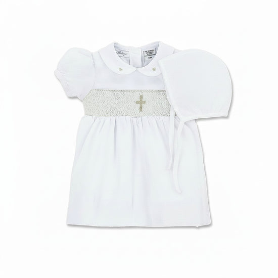 Carriage Boutique white smocked christening dress with gold cross detail on bodice and Peter Pan collar.