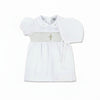 Carriage Boutique white smocked christening dress with gold cross detail on bodice and Peter Pan collar.