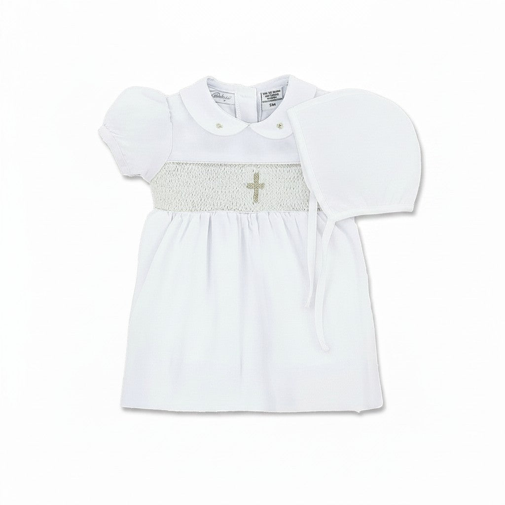 Carriage Boutique white smocked christening dress with gold cross detail on bodice and Peter Pan collar.