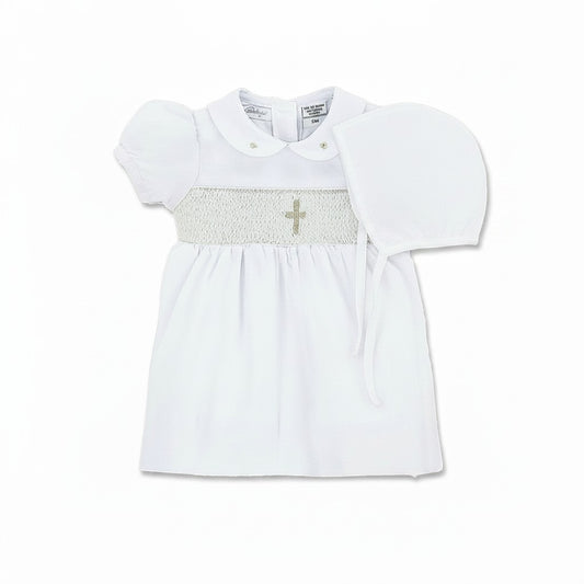 Carriage Boutique white smocked christening dress with gold cross detail on bodice and Peter Pan collar.
