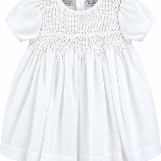 Carriage Boutique white baby girl christening voile dress with delicate smocked bodice and puff sleeves