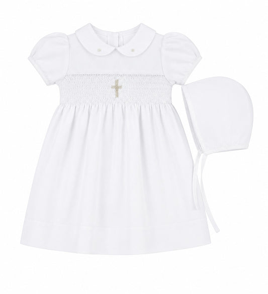 Carriage Boutique white baby girl christening dress with smocked bodice, cross embroidery, and matching bonnet.