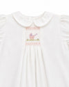 Carriage Boutique white heirloom dress with hand-smocked bodice, Peter Pan collar, and pastel pram embroidery.